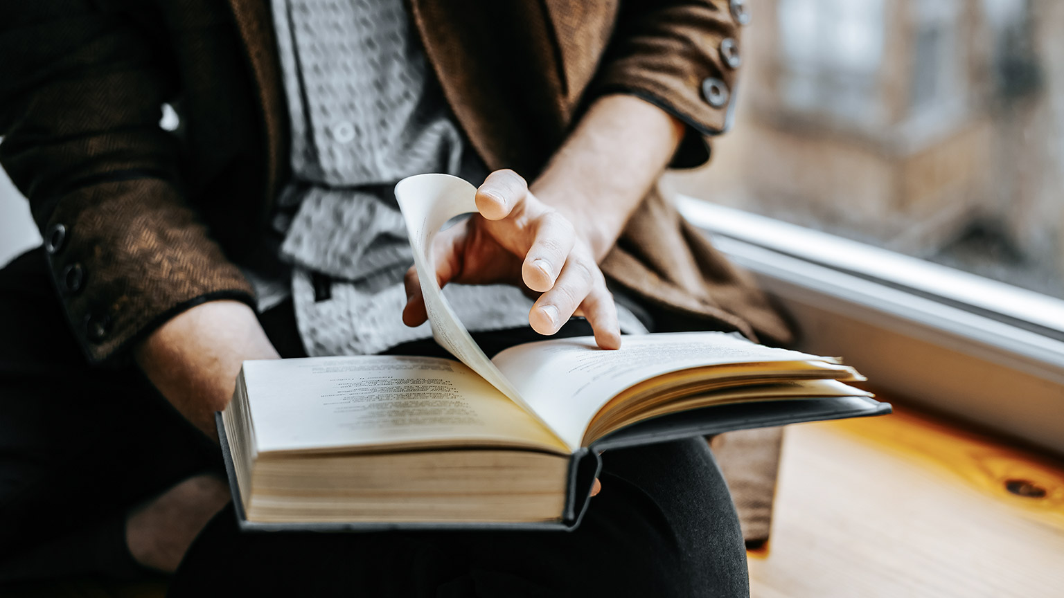 Young man reading a book