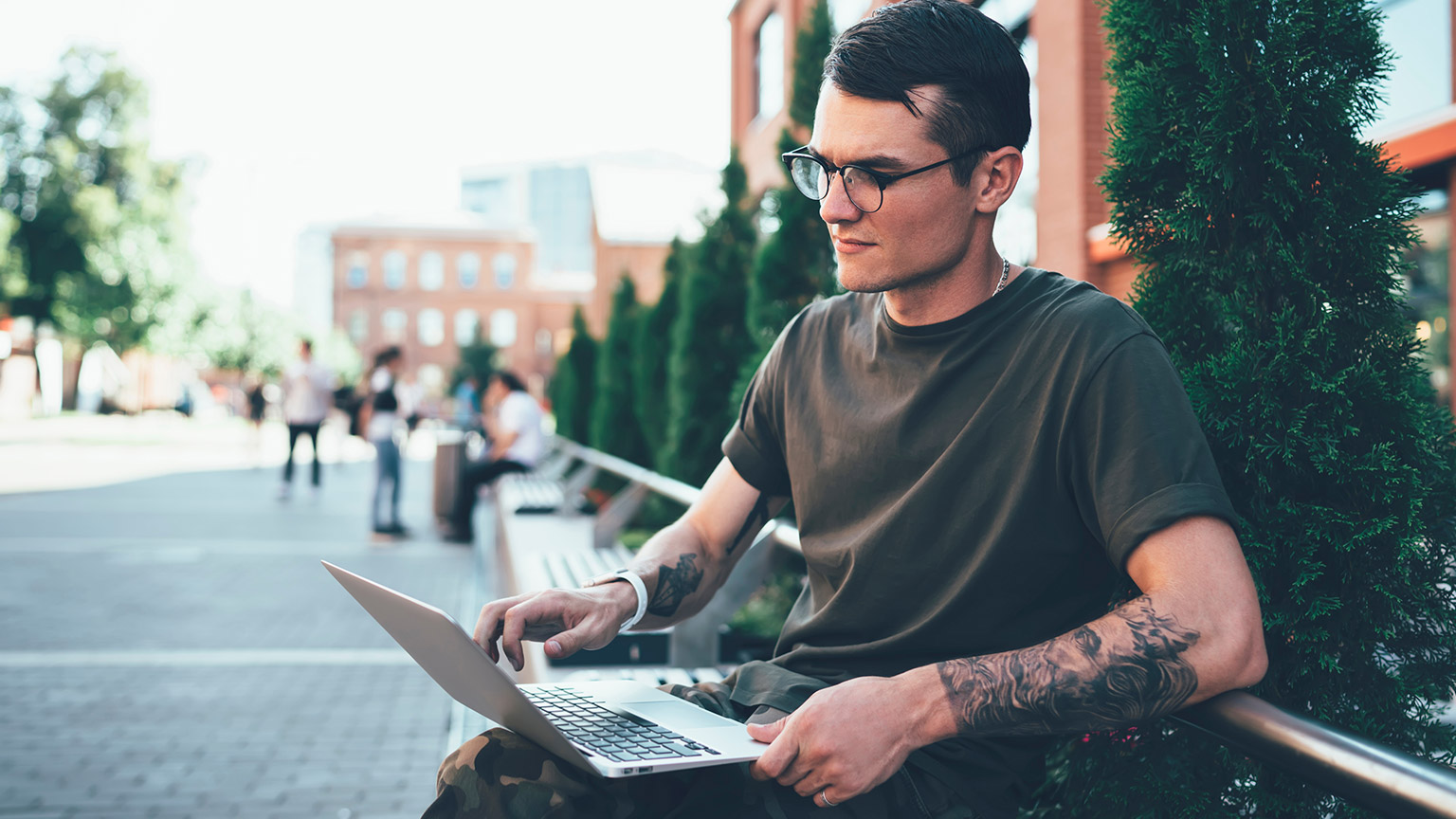 A person reading articles on a laptop