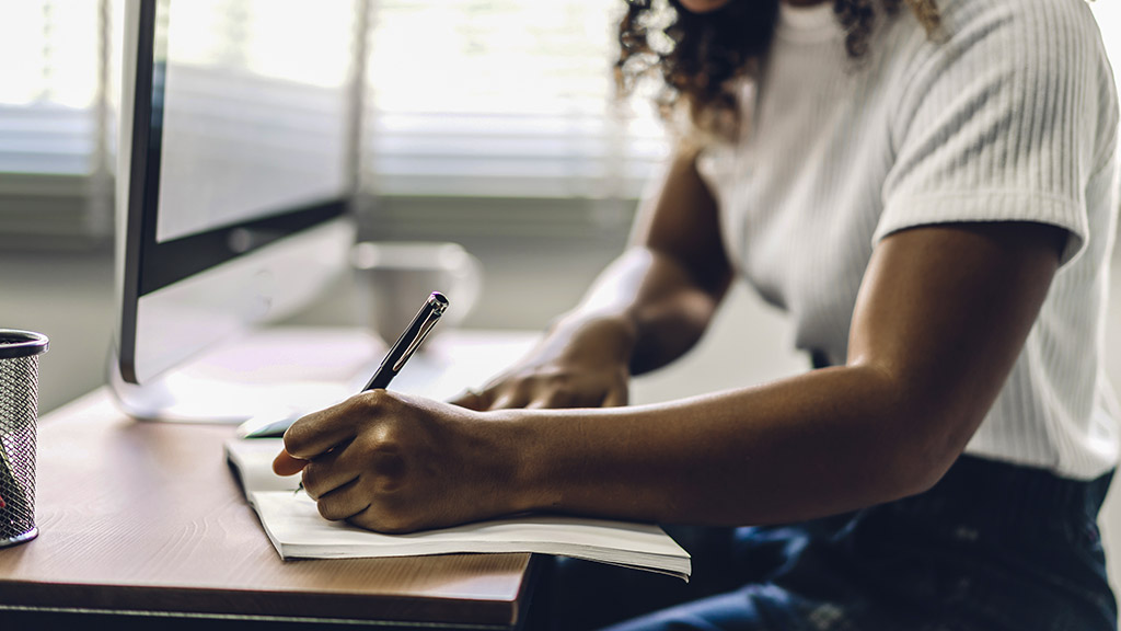 woman working with laptop computer. planning, and using pen