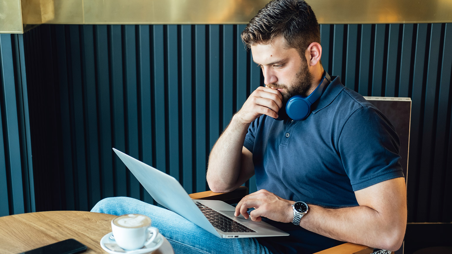 A person reading information on a laptop