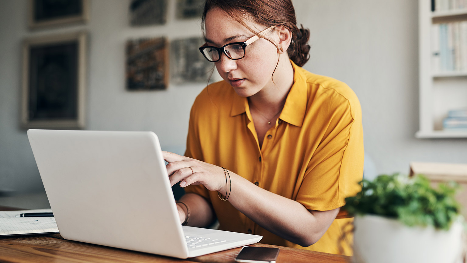 A person reading information on a laptop