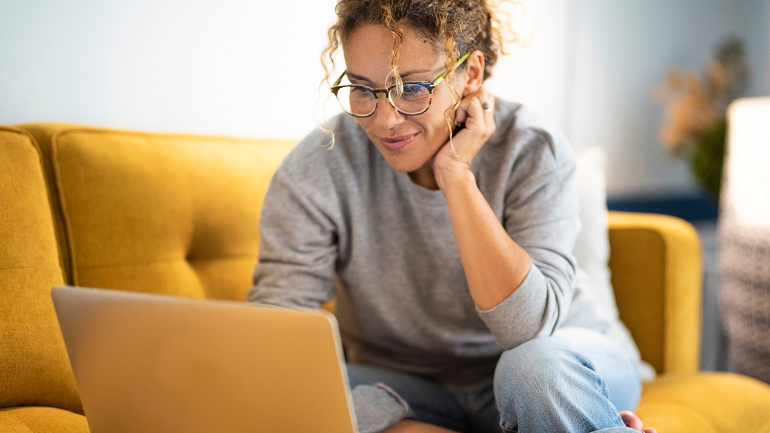 A person reading information on a laptop