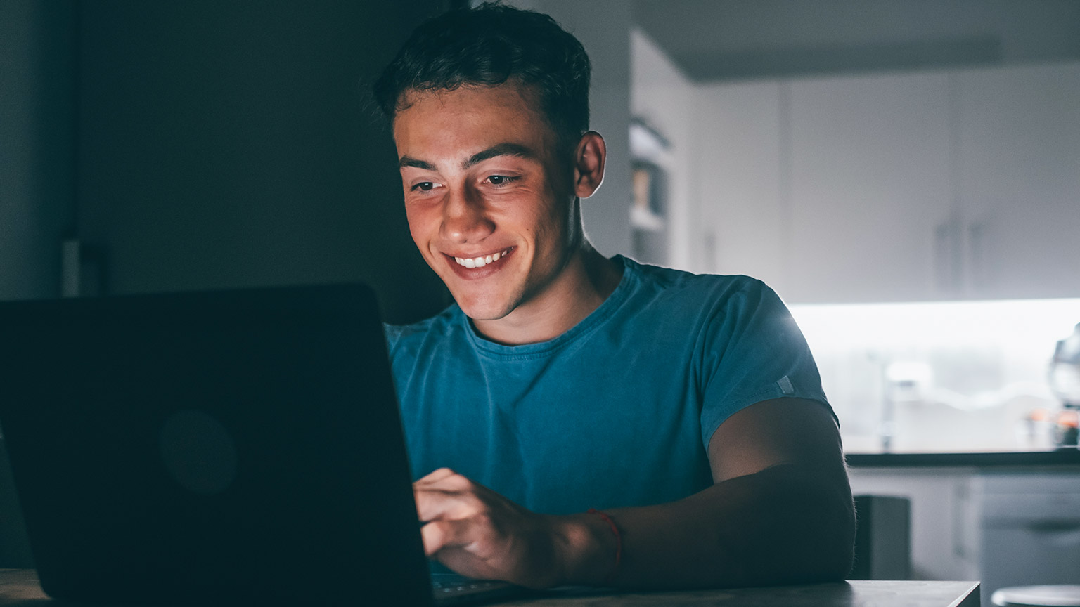 A person studying information on a laptop