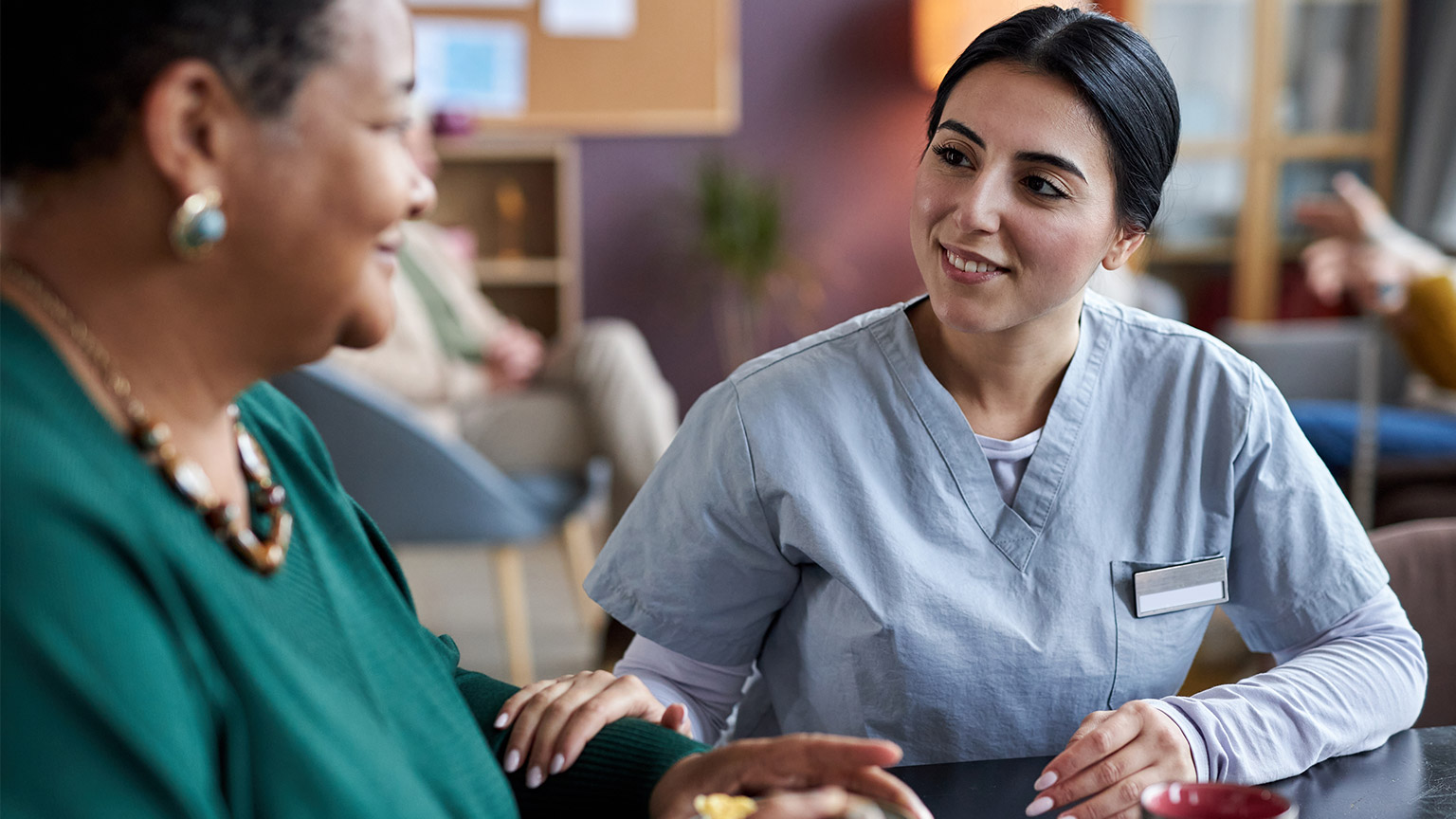 A worker talking to a client with a pleasant smile