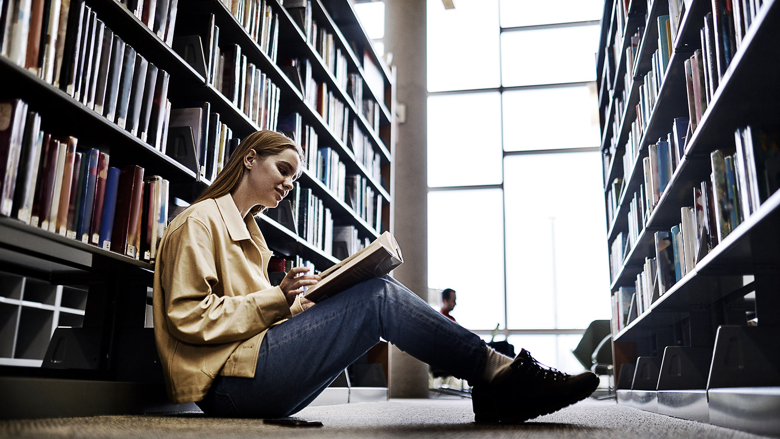 A person reading in a library