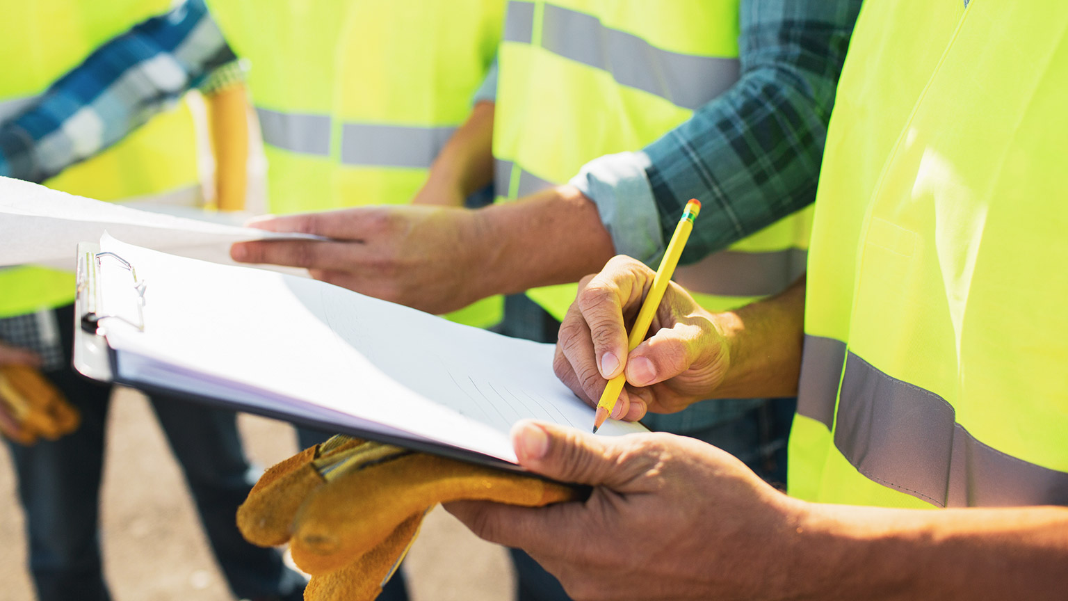 Tradies doing paperwork on site