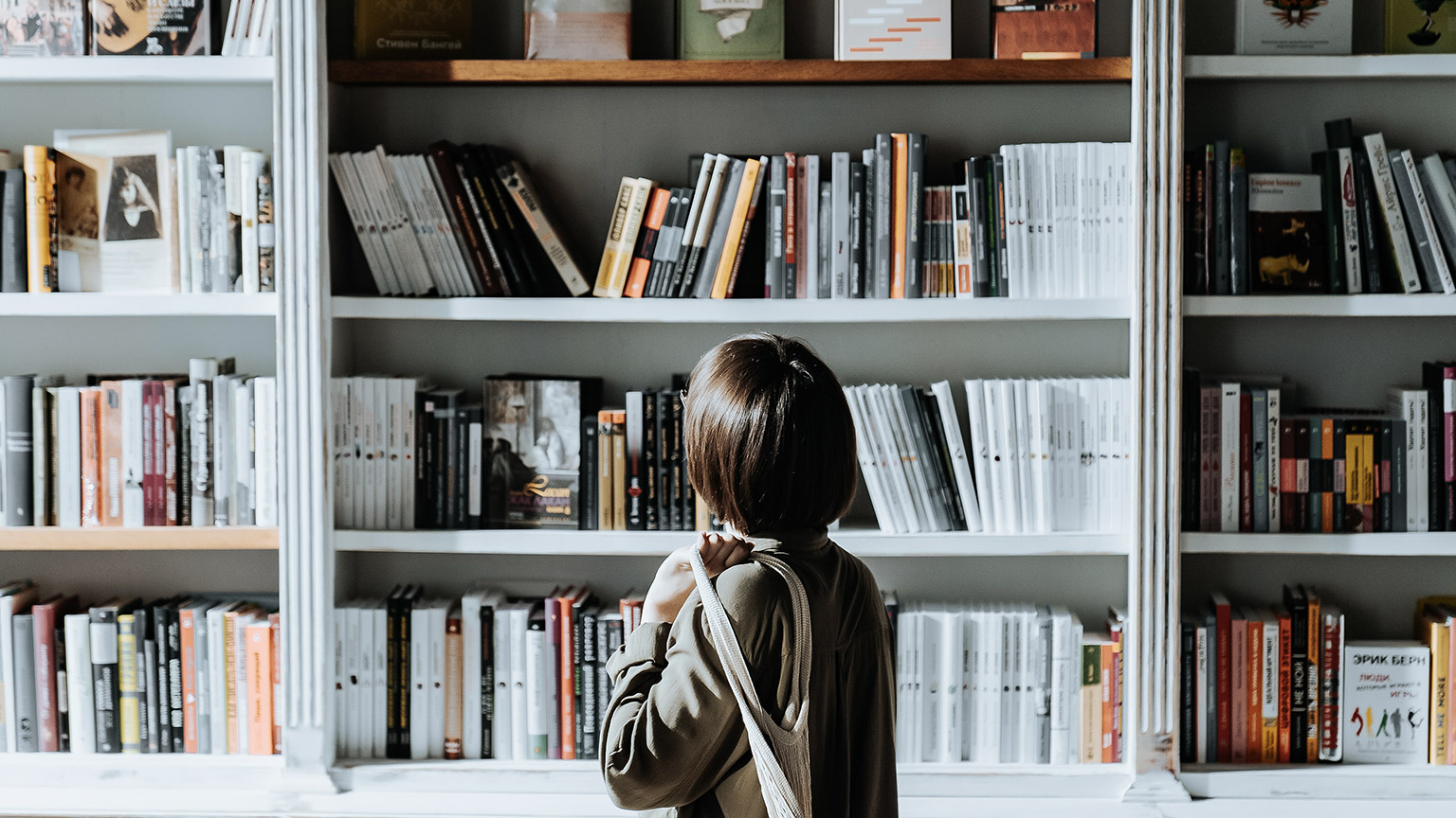 Female browsing books in the library