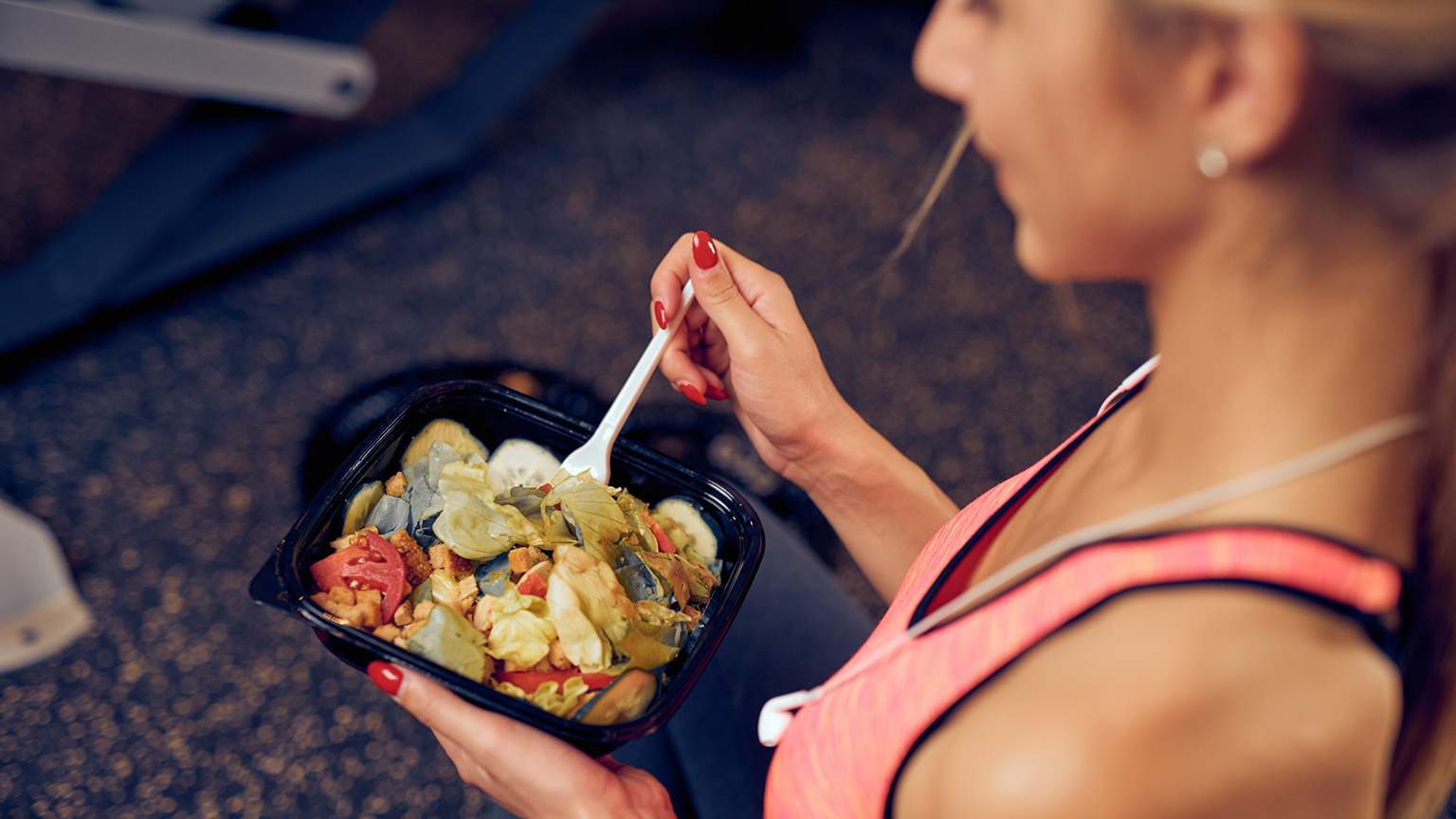 A person eating a healthy meal after exercise