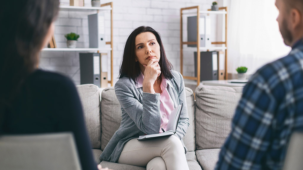 psychologist talking with couple during private consultation