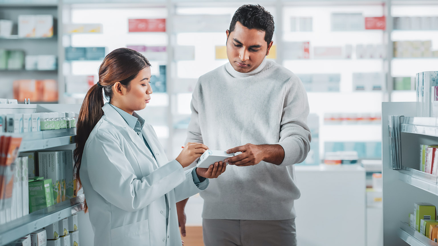 A pharmacist talking to a client