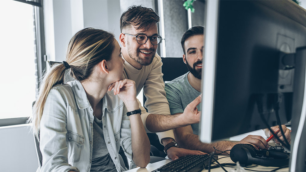 Group of programmers and software developers working on a new project at the office.