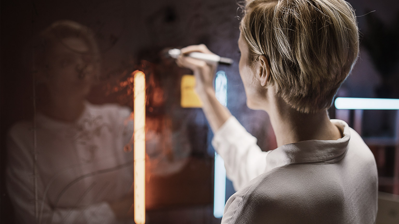 a person planning on a glass board