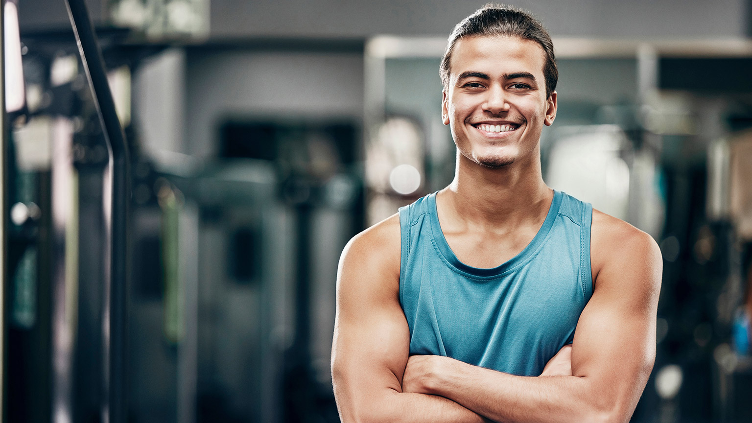 A personal trainer in a modern gym