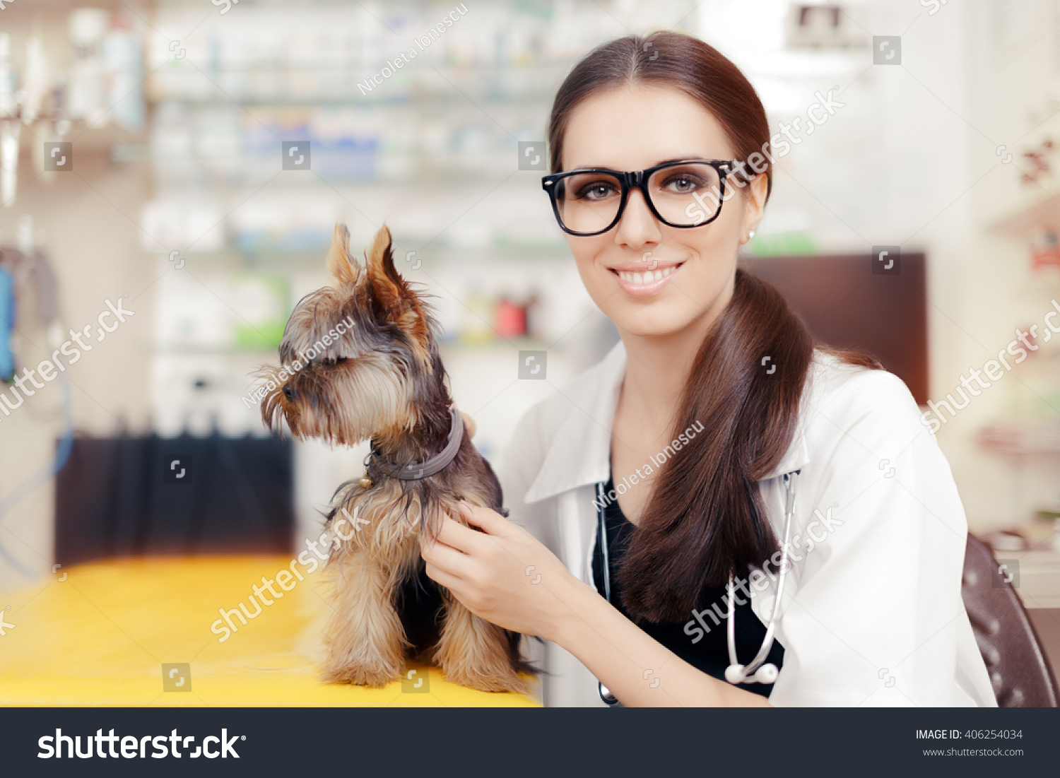 Young Veterinarian Female Doctor with Cute Dog 