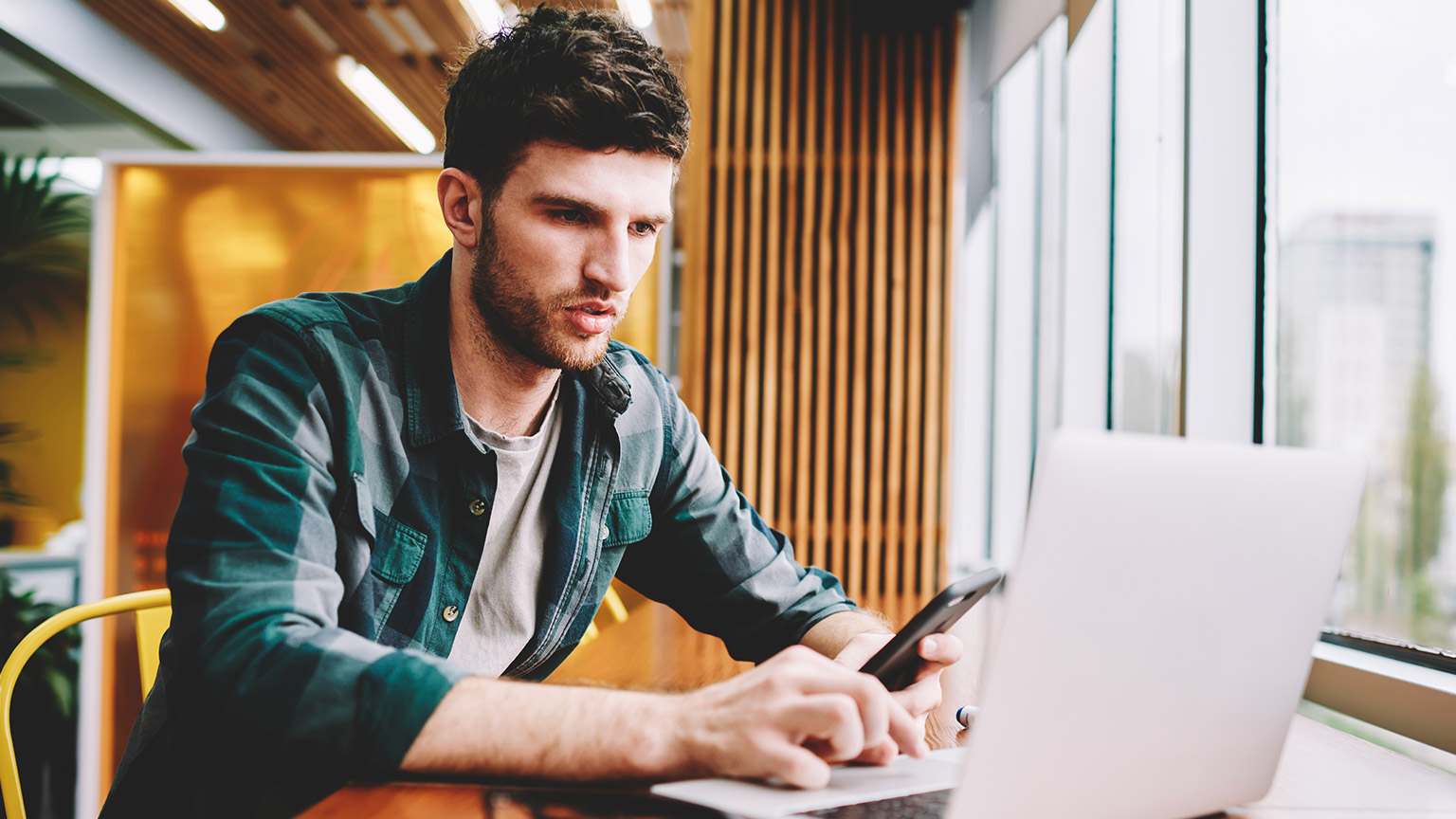 A person reading information on a laptop