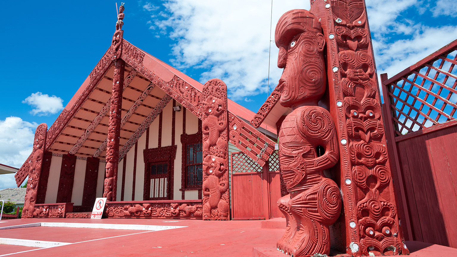 This image shows a maori marae (meeting house and meeting ground)