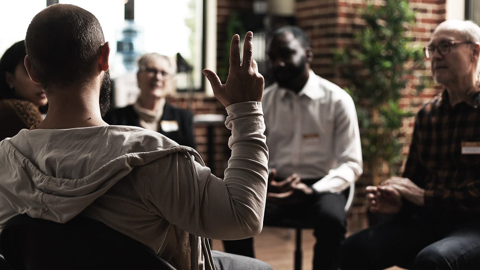 sharing problems with group at meeting, talking to therapist