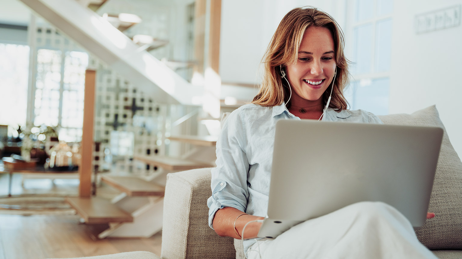 A person reading information on a laptop