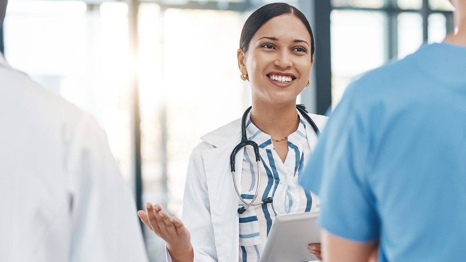 A doctor talking to colleagues