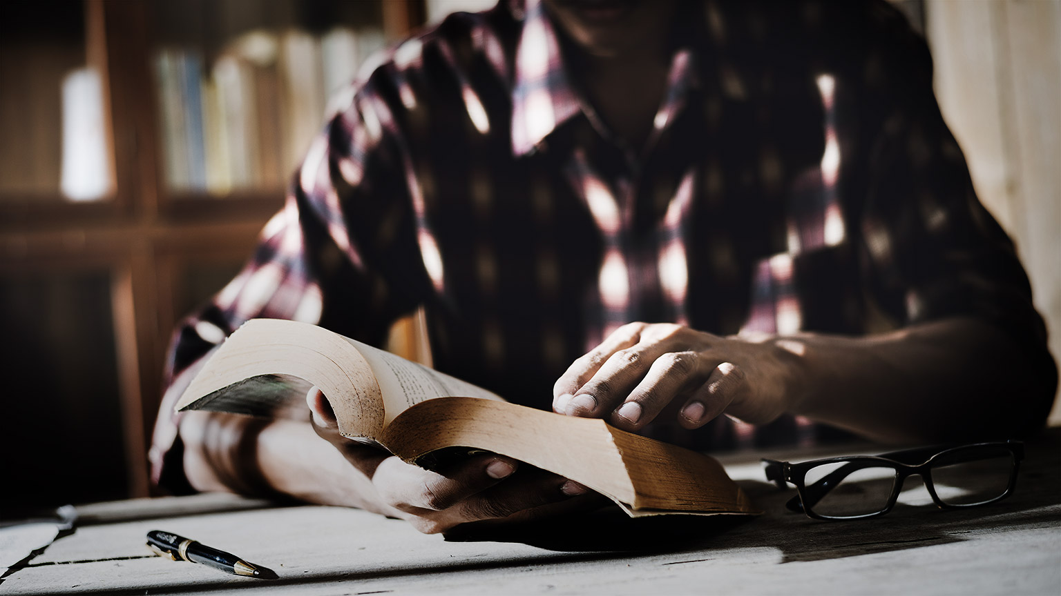 A person reading in a library