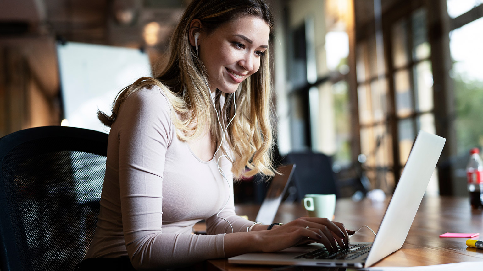 A person reading information from a laptop