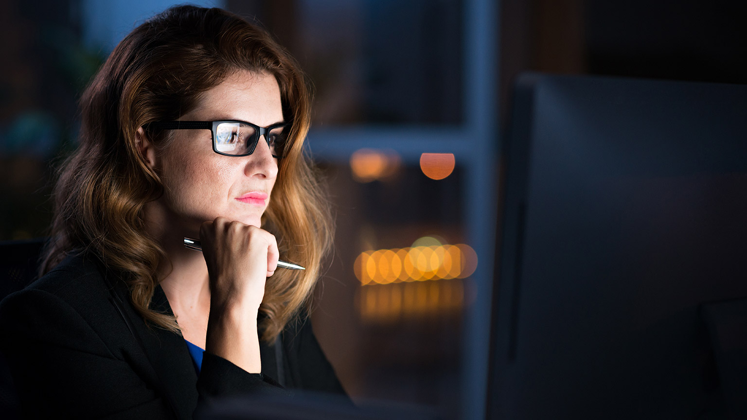 A person reading information on a computer screen