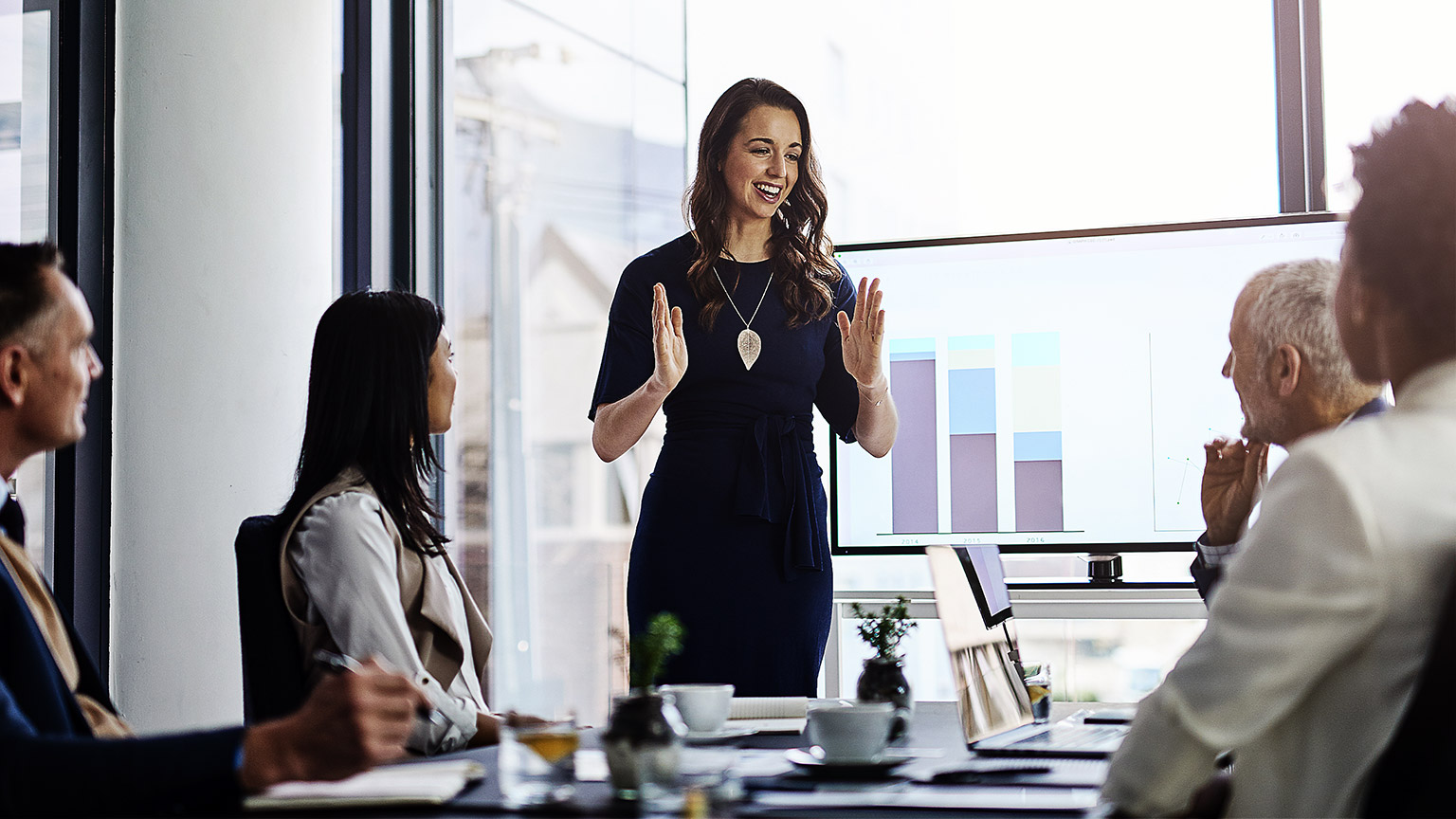 A group of employees in a policy presentation