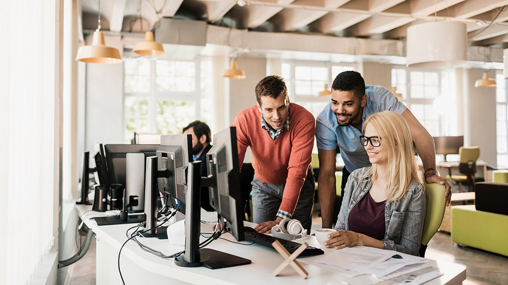 Young people working together on a project in a startup company office