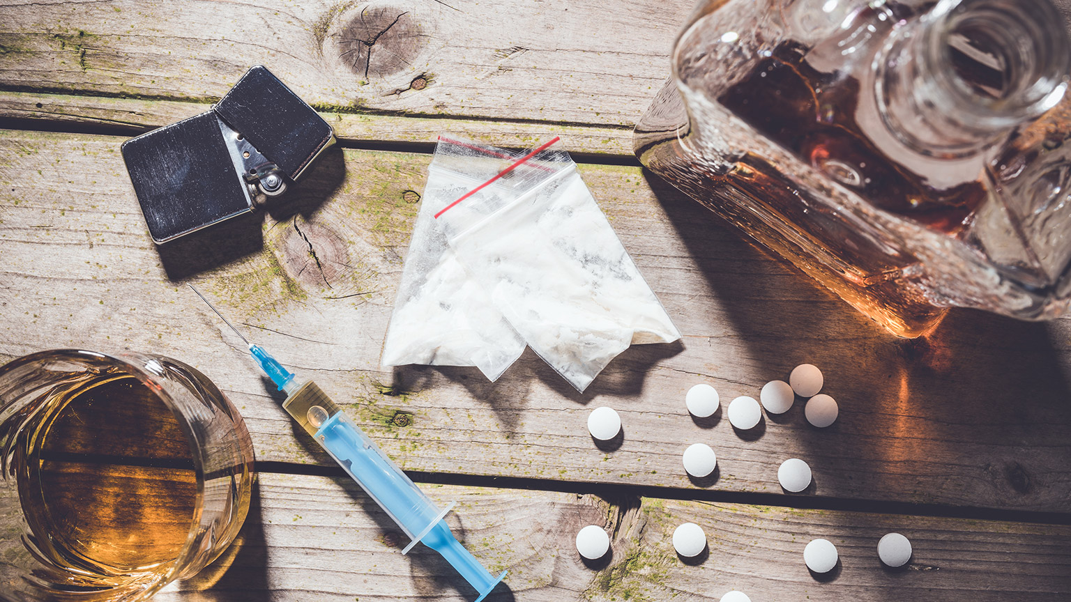 A selection of alcohol and drugs on a table