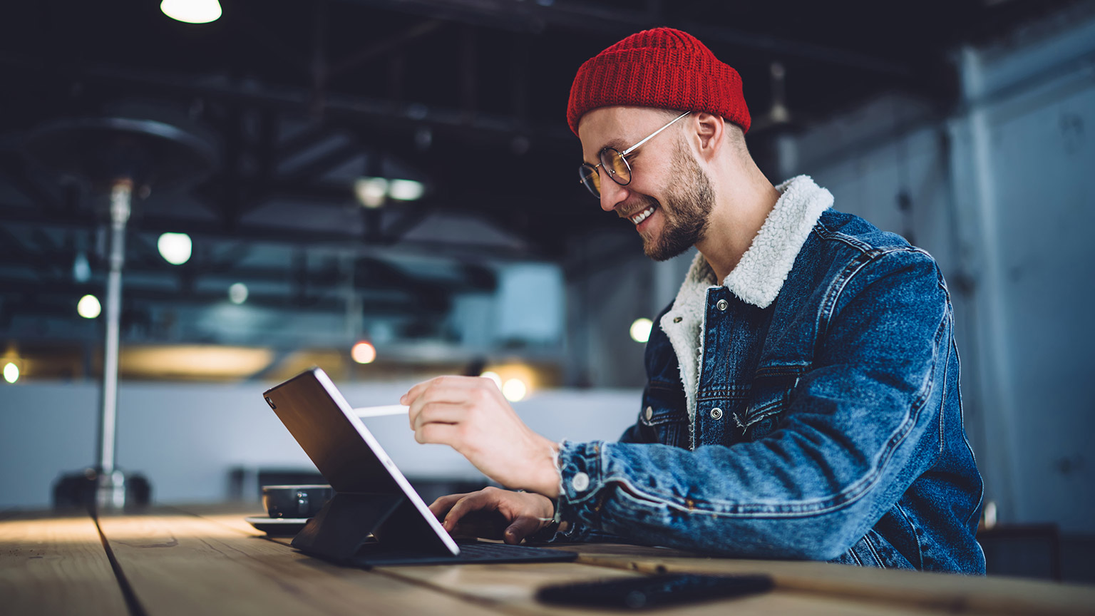 A hipster animator working in a modern office space