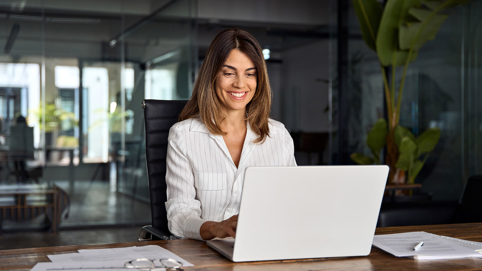 An accountant working on a job in a modern office space