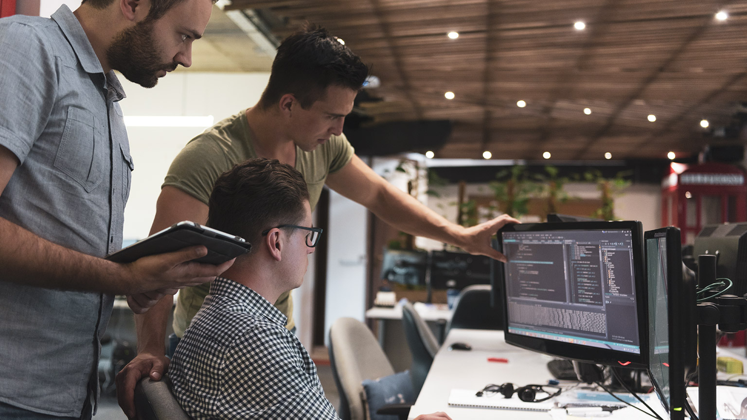 IT workers looking at a screen