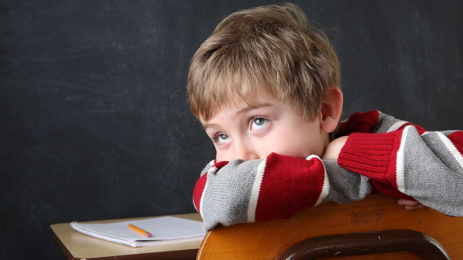 A young child with a learning disorder in a classroom