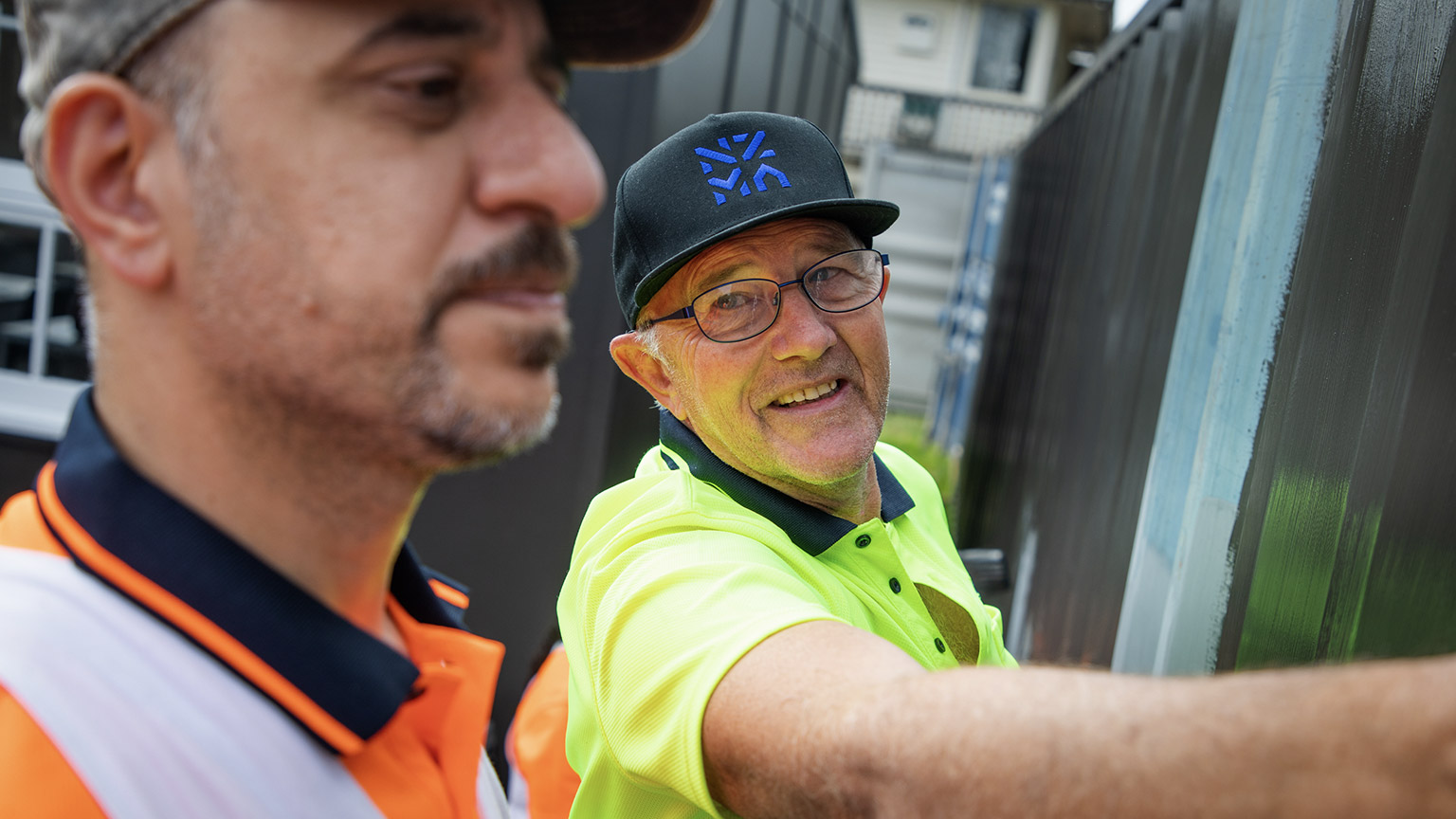 A tradesman talking to a colleague