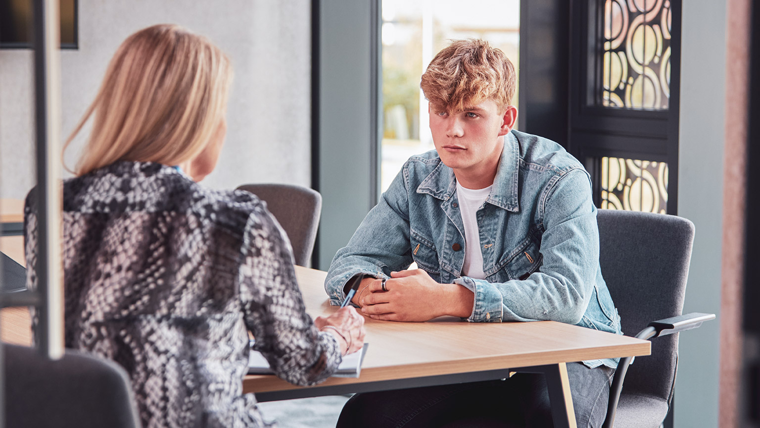 A counsellor talking to a client