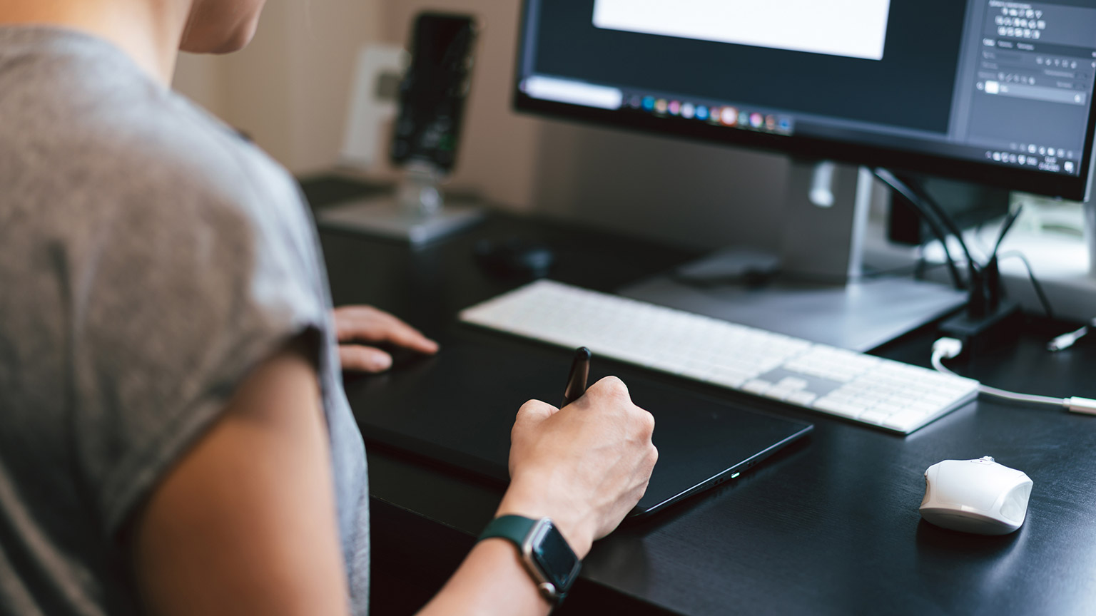 Over-the-shoulder view of a designer at work