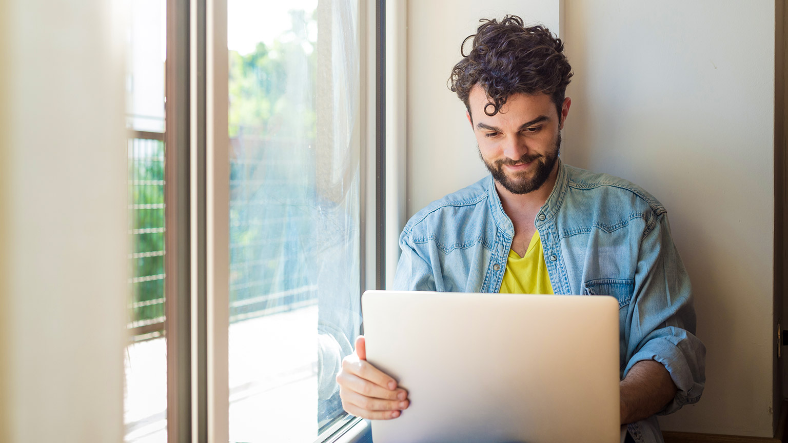 A person reading information from a laptop