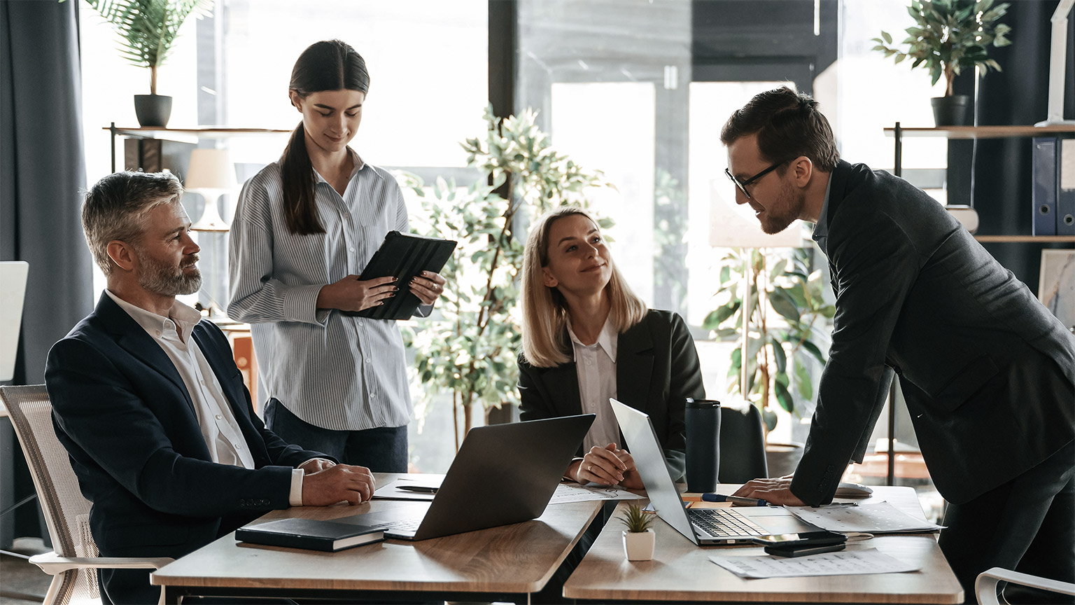 A group of people preparing for a presentation