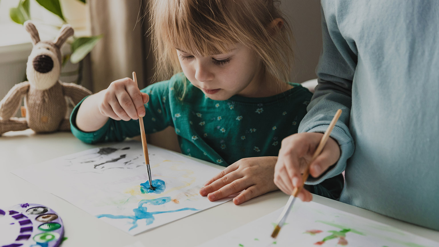 A young child painting