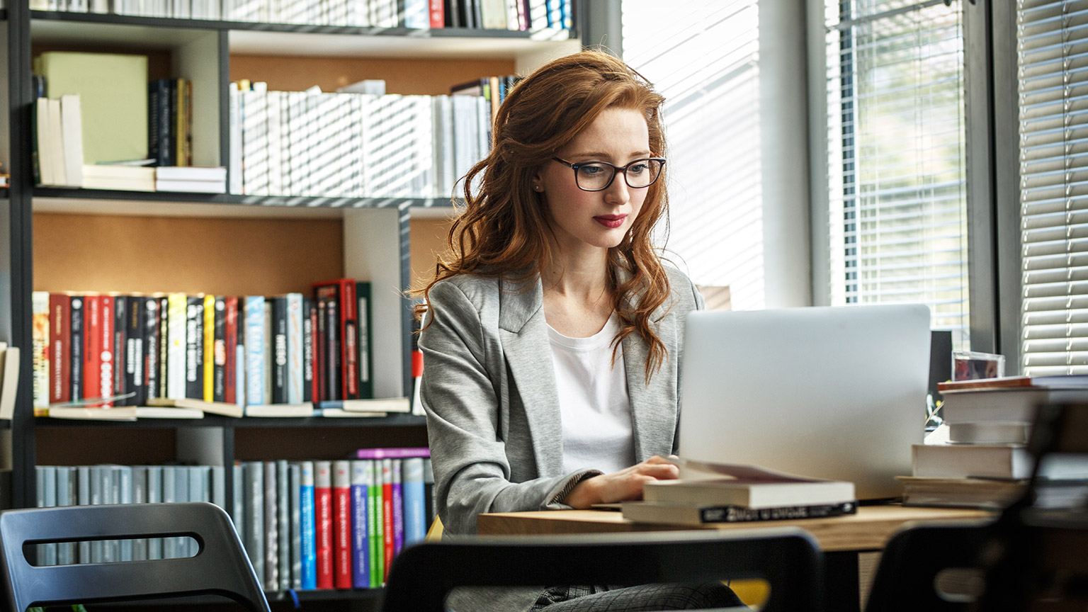 A person studying in a library