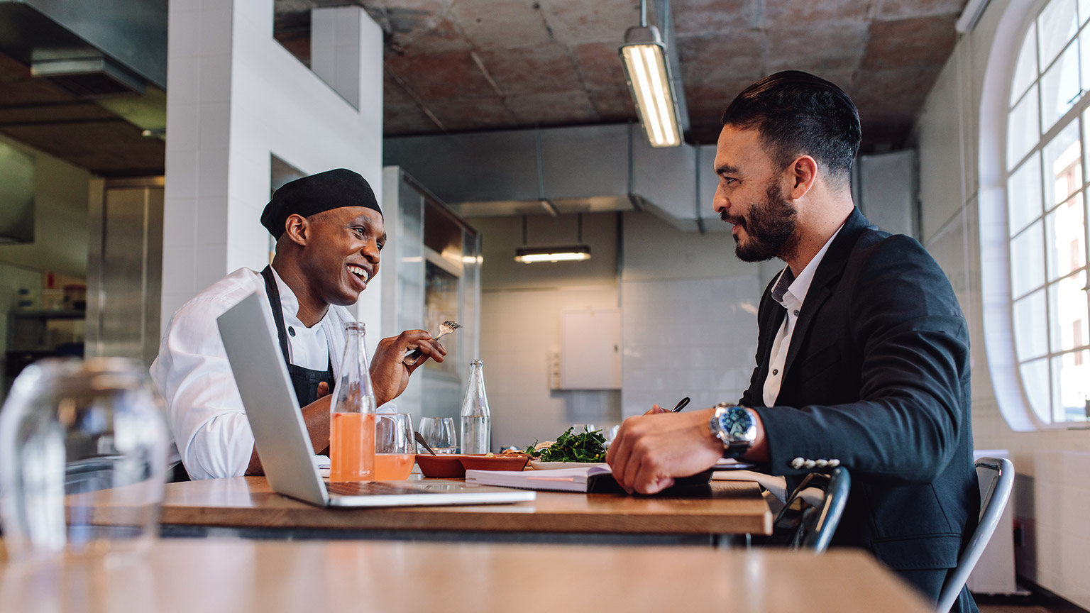 A manager and chef talking