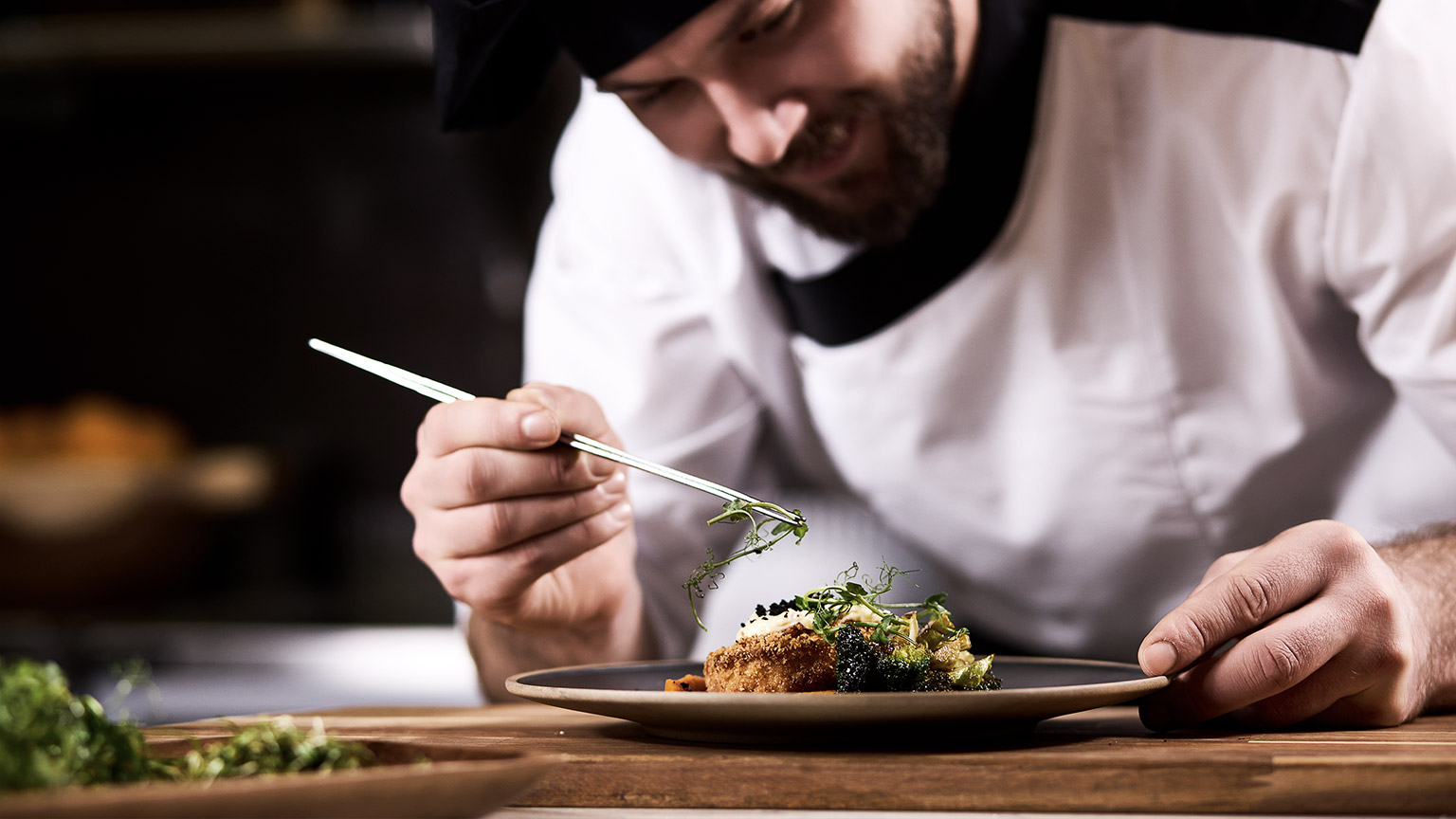 Chef dressing salad