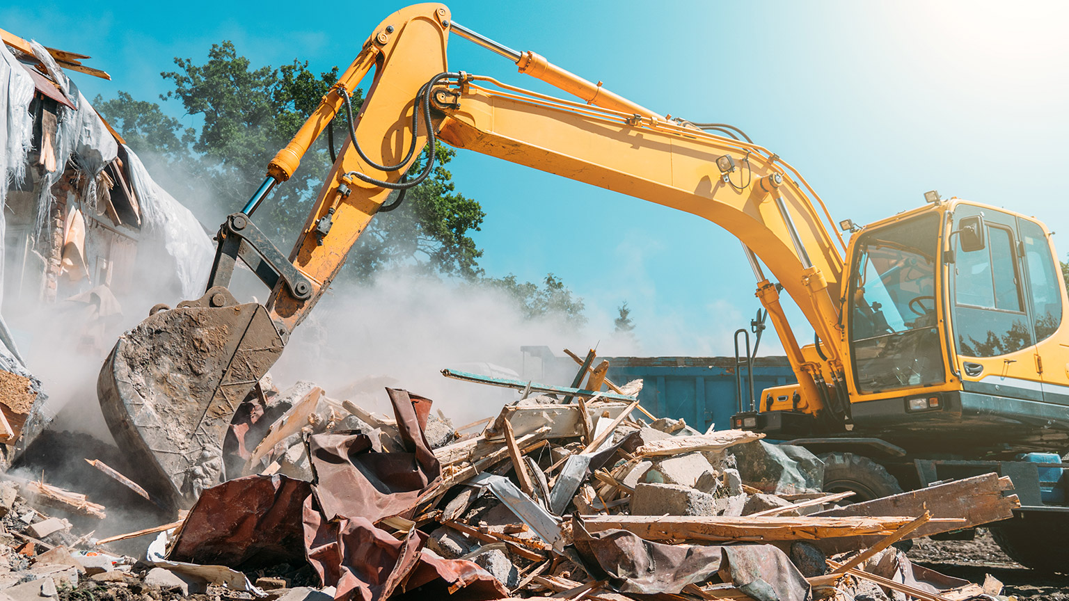 An excavator demolishing stuff