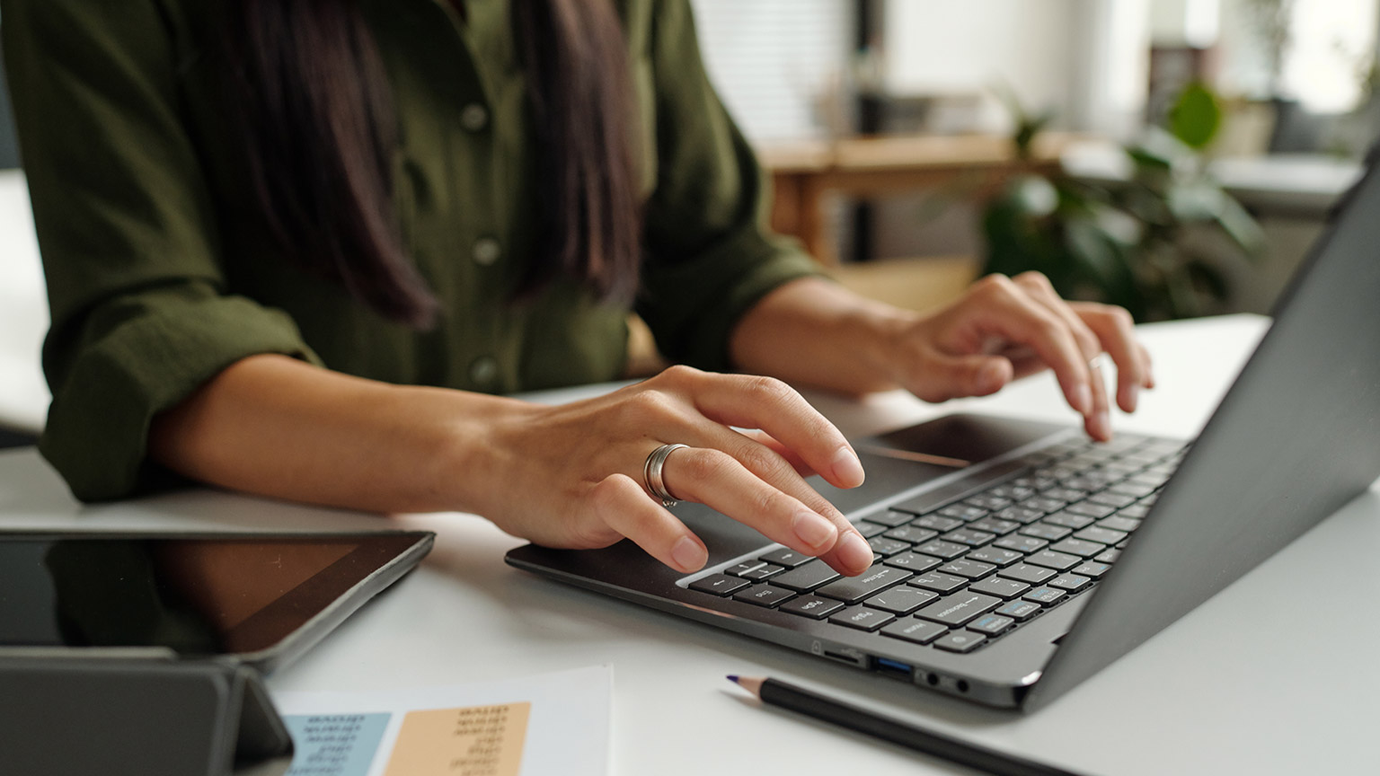 A person typing on a keyboard