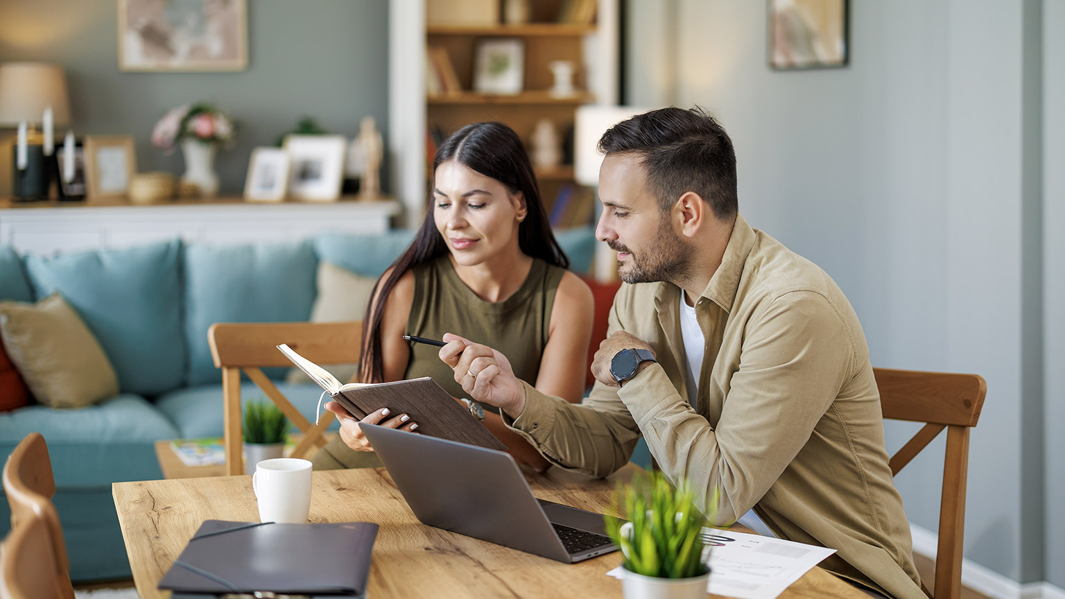 a man and woman brainstorming at home office setup