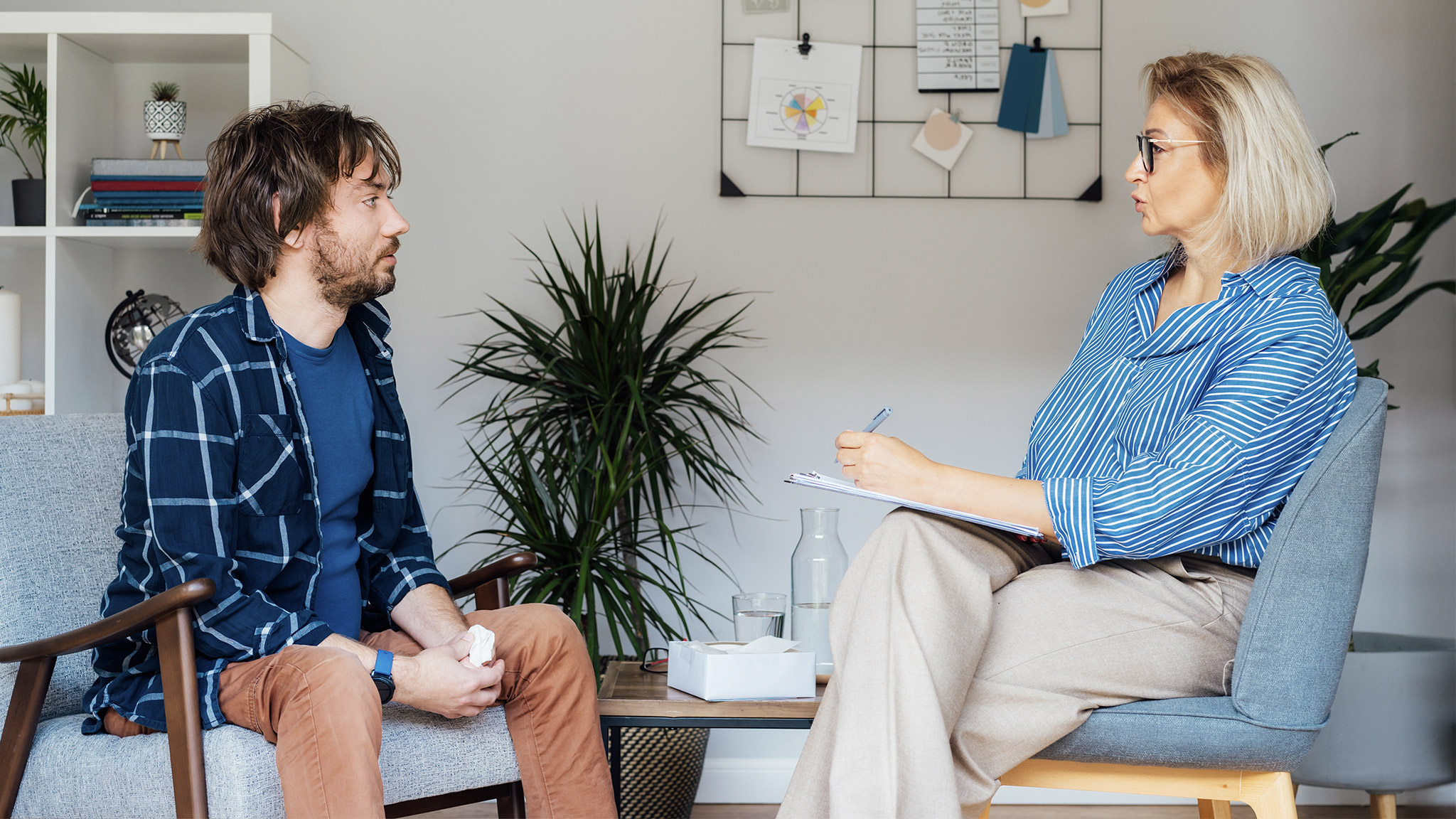 Depressed male patient having psychotherapy session