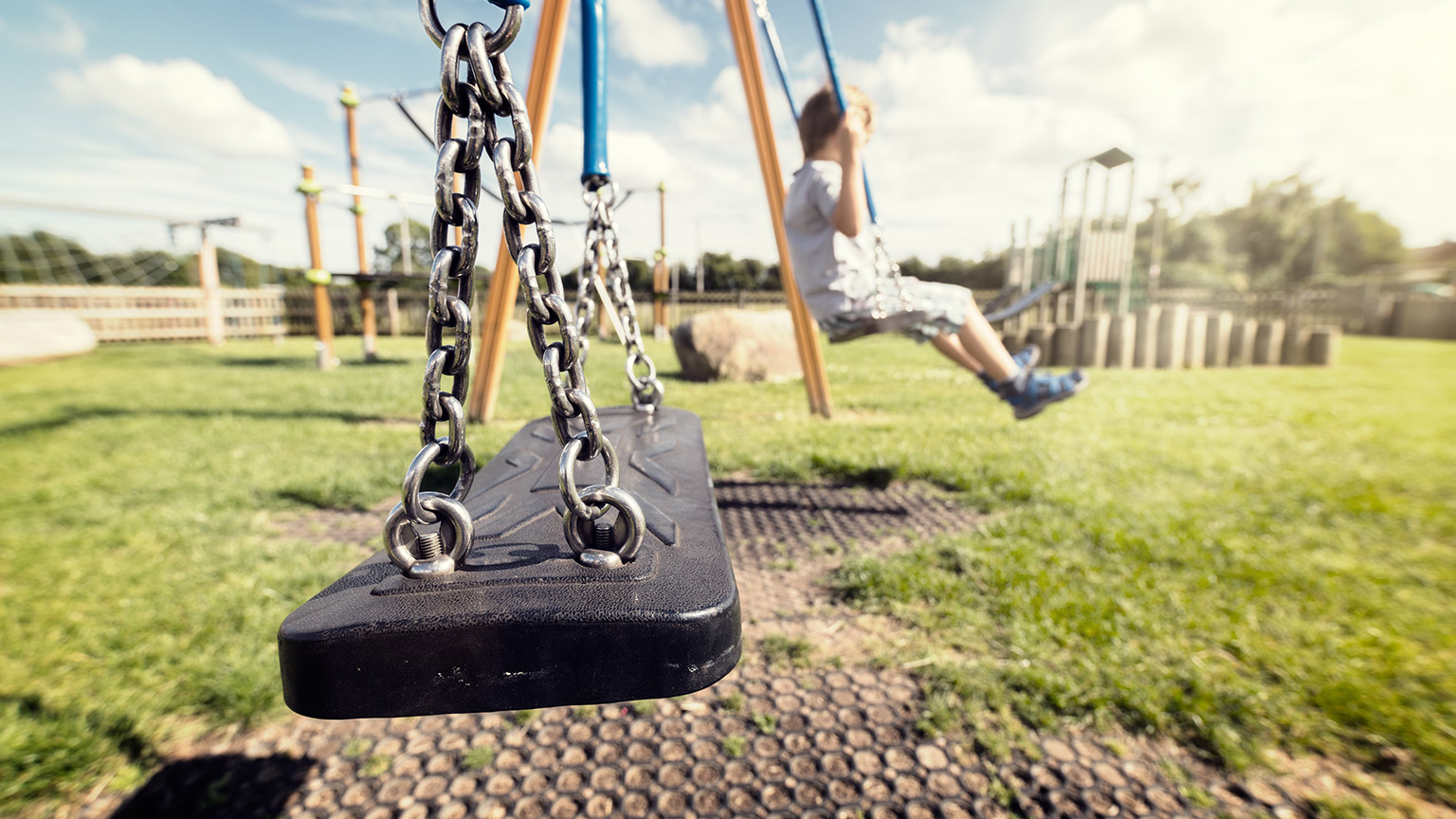 Kids outside on swings