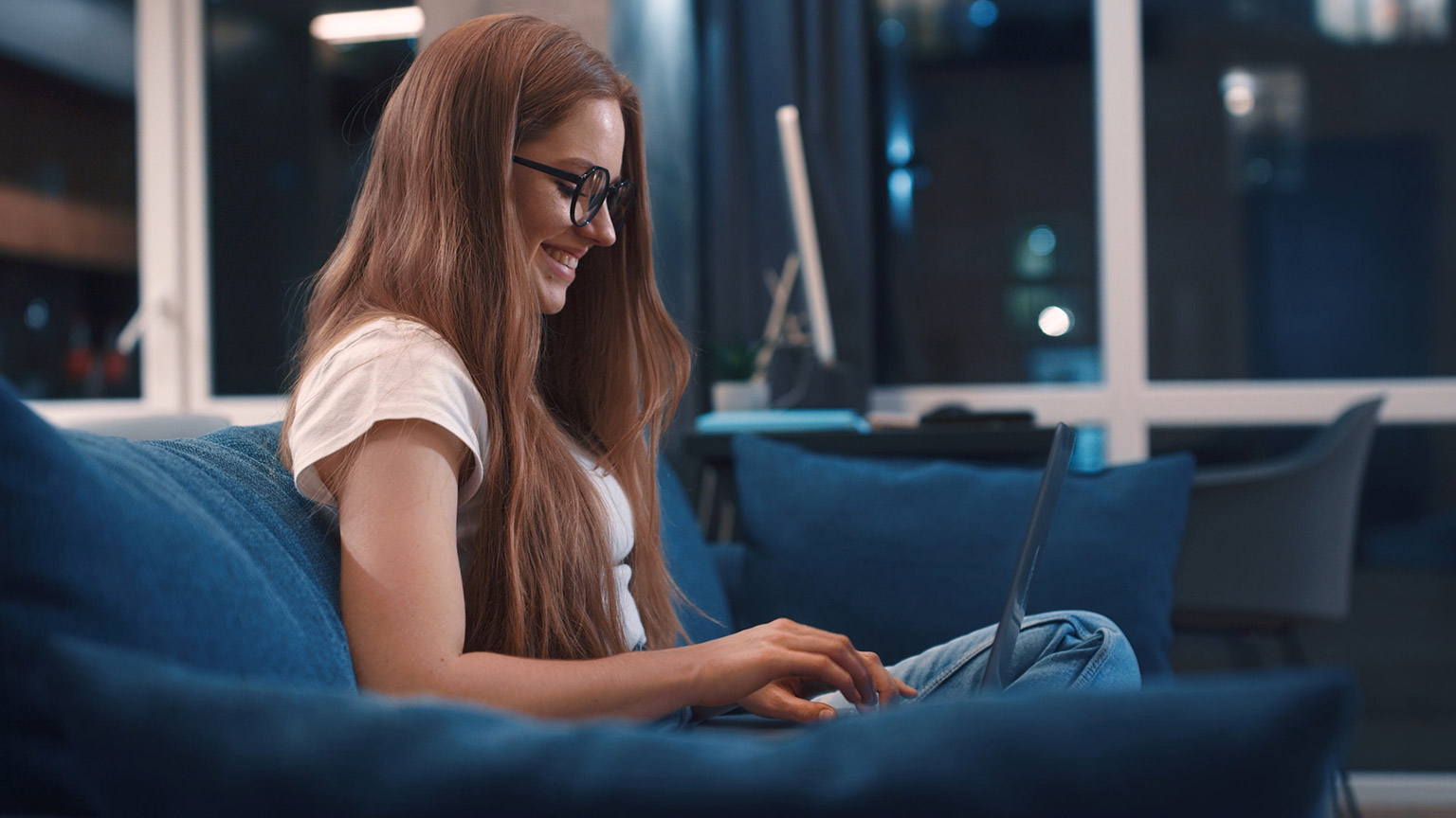 A person reading information on a laptop