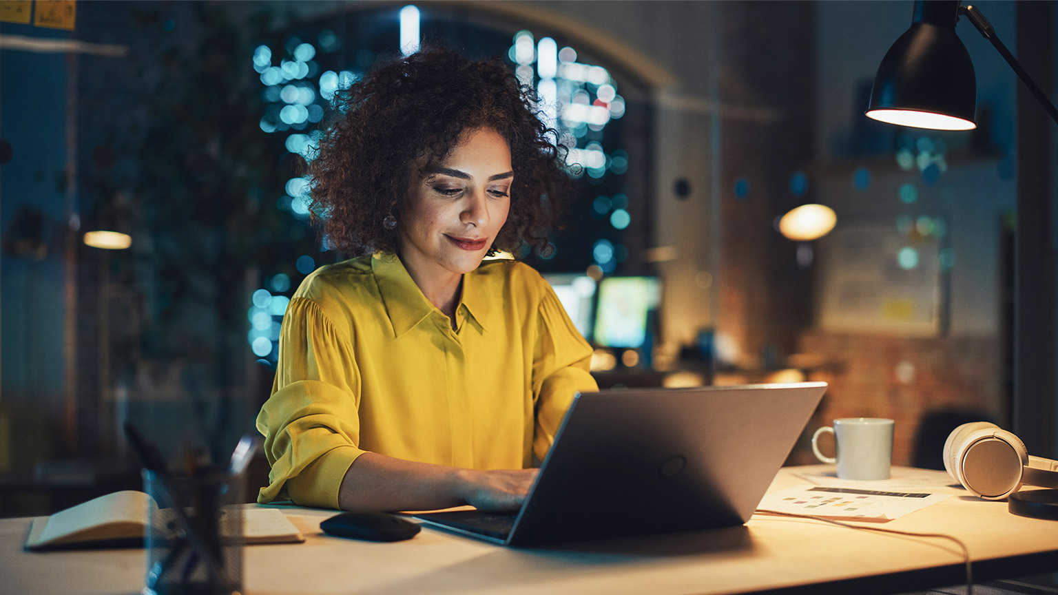 Confident Arab Female Sitting in Creative Agency in the Evening