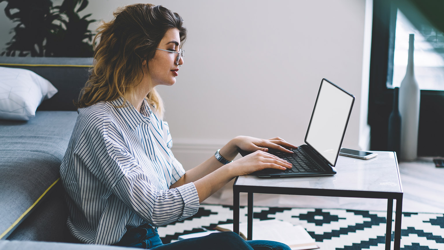 A person reading information from a laptop